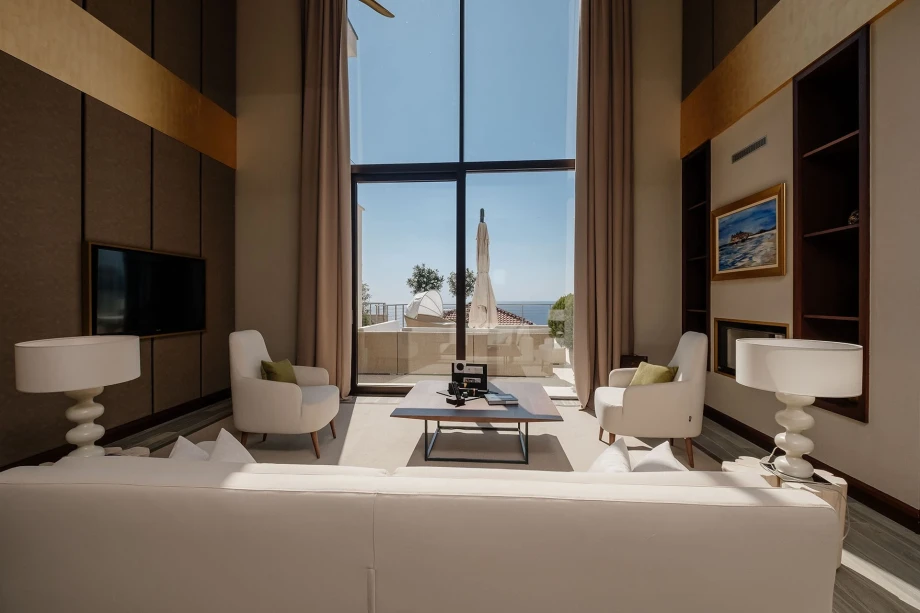 Spacious Living Room with Floor-to-Ceiling Windows at Ananti Signature Villa
