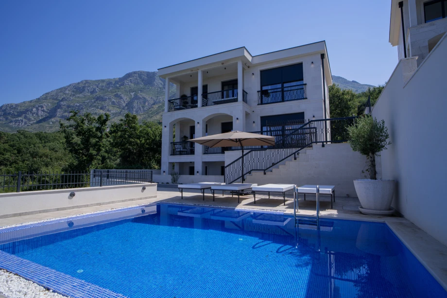 Stunning Villa Exterior Surrounded by Lush Greenery and Breathtaking Views