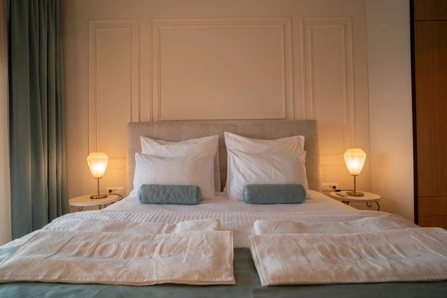 Elegant Bedroom with Plush King-Size Bed and Serene Atmosphere