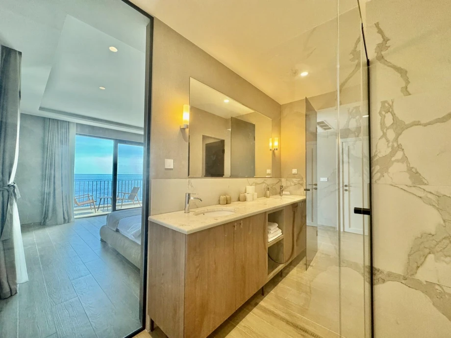 Elegant Bathroom with Walk-In Shower and Sleek Finishes at Villa Solis