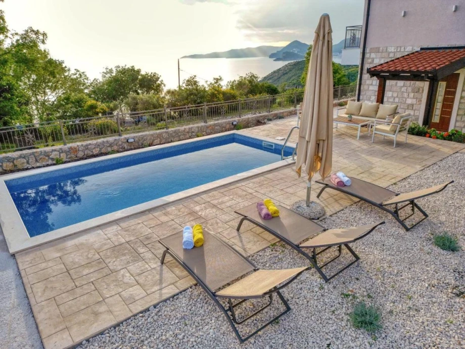 Relaxing Sunbeds by the Pool at Stone Villa