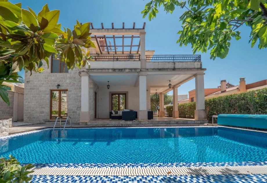 Spacious Outdoor Pool with Sunbathing Area at the Villa