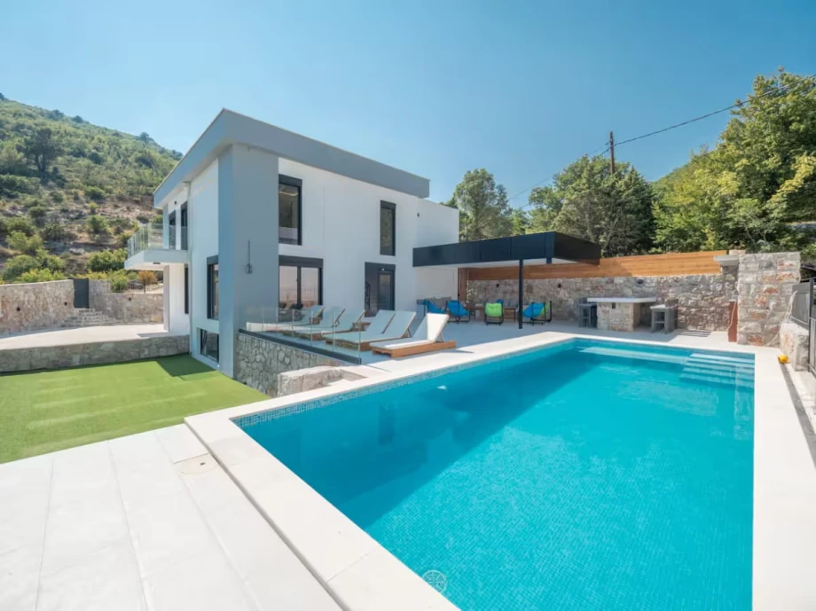 Inviting Outdoor Pool Area with Sun Loungers at the Villa