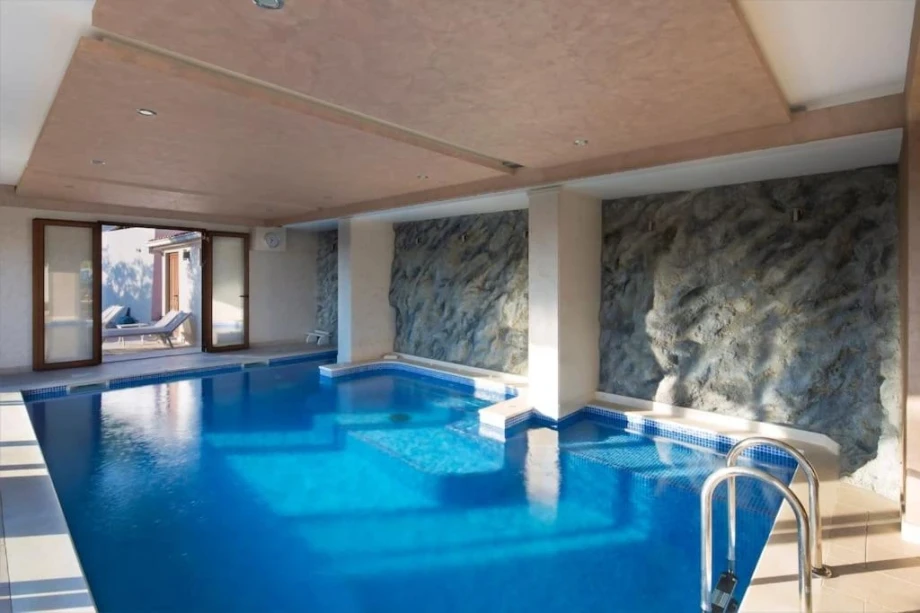 Spacious Indoor Pool with Elegant Design and Relaxing Atmosphere