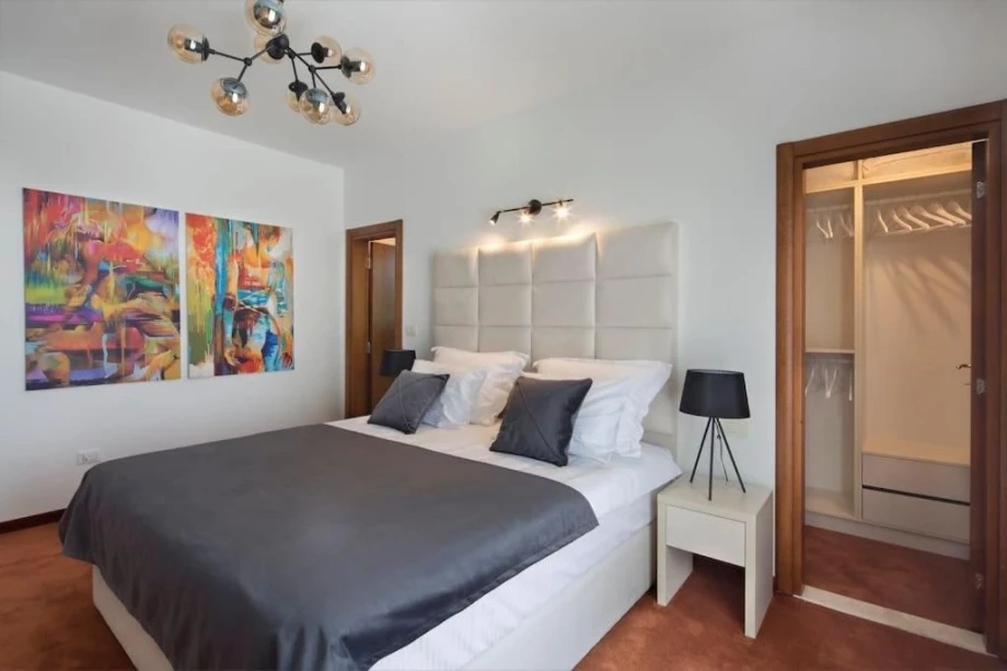 Lit Bedroom with Cozy Atmosphere and Elegant Decor