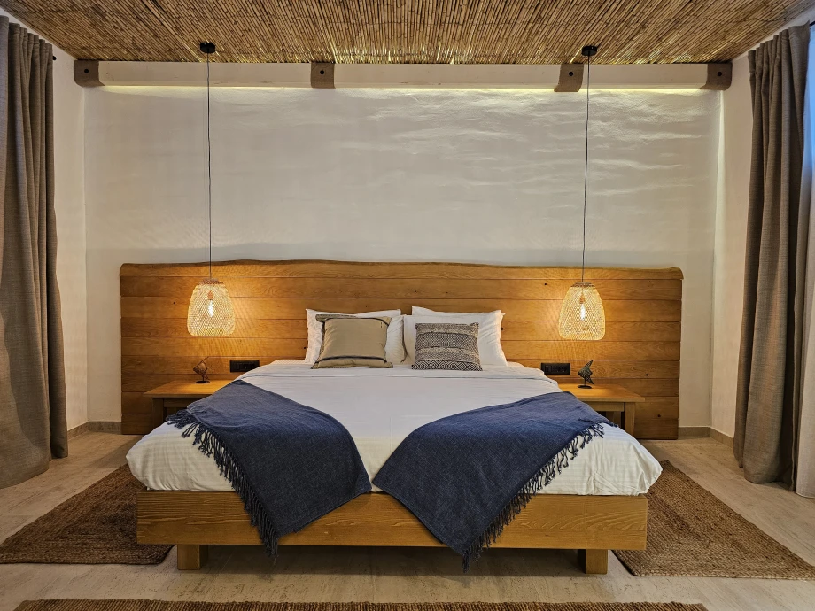 Elegant Bedroom with King Bed and Natural Stone Accents in Montenegro Villa