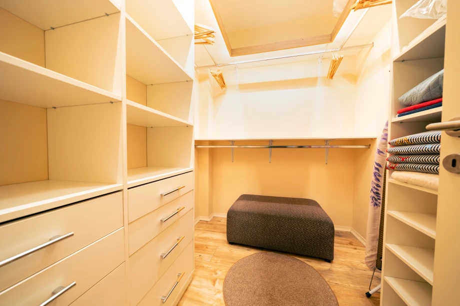 Spacious Closet with Organized Shelving and Ample Storage Space for Your Belongings