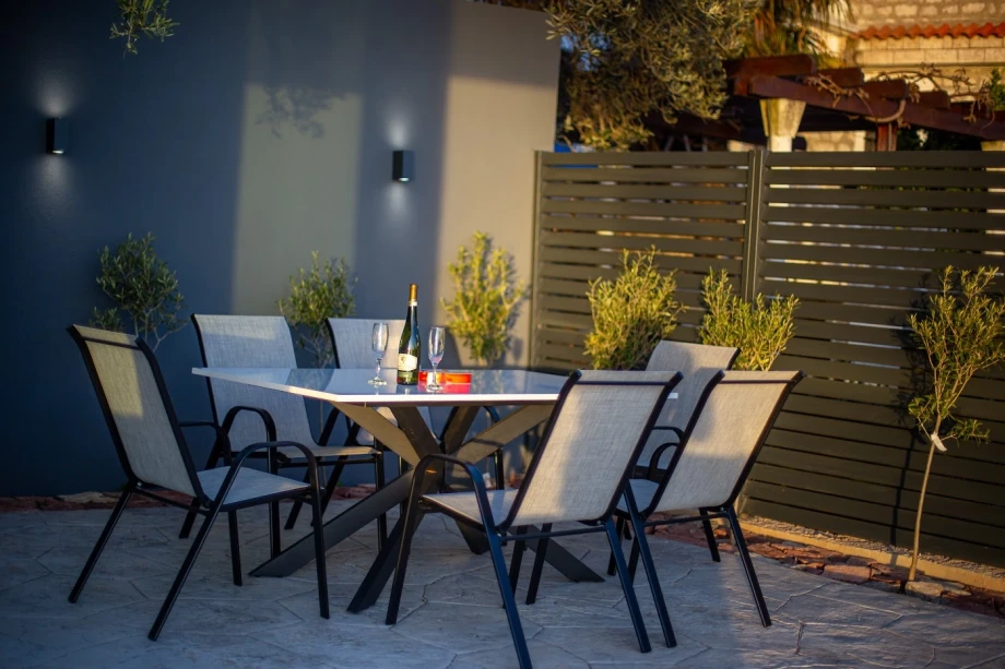 Outdoor Dining Table Set Amid Lush Garden at Montenegro Villa