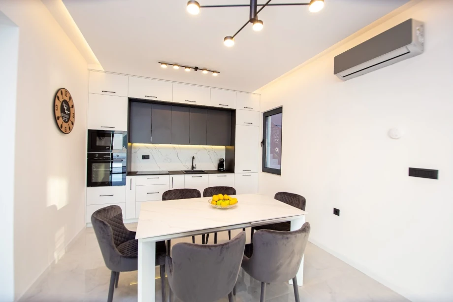 Dining Table with Elegant Seating in Open-Plan Villa Interior – Montenegro Retreat