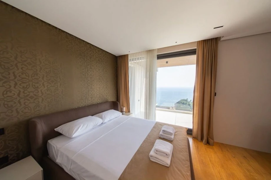 Comfortable Bed with Elegant Linen – Serene Bedroom Corner in the Villa