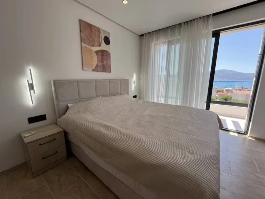 Spacious Room with King Bed, Elegant Details, and Warm Lighting – Montenegro Luxury Villa