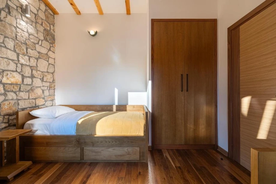 Rustic Stone Wall Accent in Bedroom