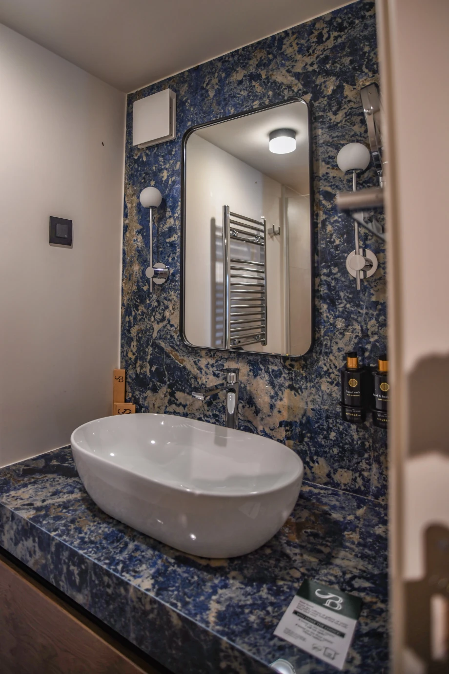 Stylish Bathroom with Decorated Sink and Modern Finishes