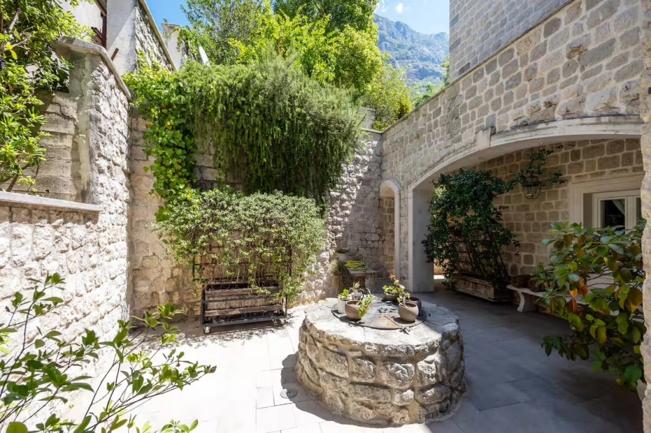 Hidden Garden Courtyard with Historic Stone Architectural Elements