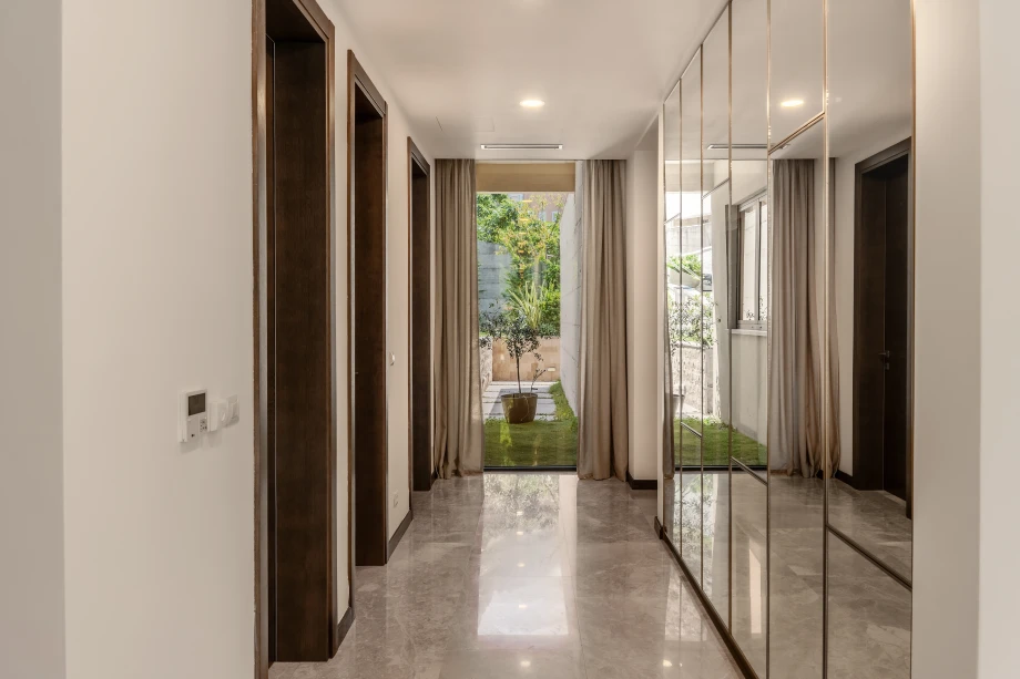 Villa corridor with elegant lighting and wall accents