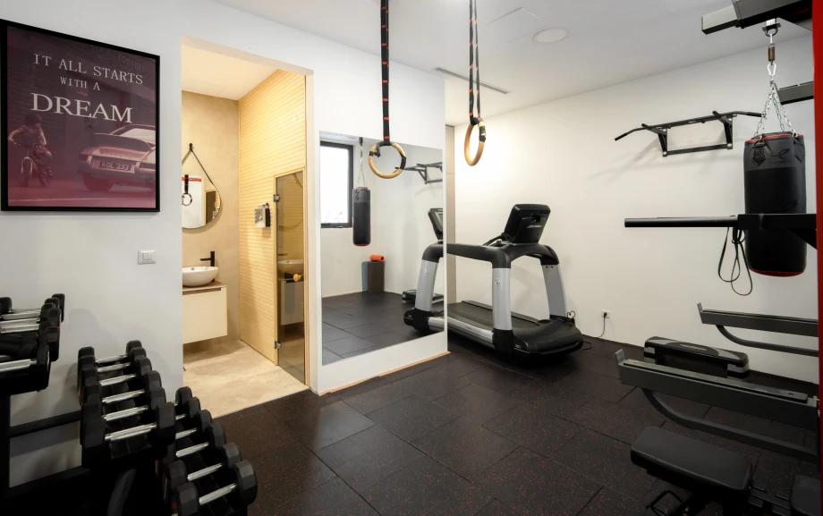 Villa gym with modern exercise equipment