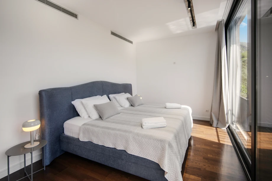 Bright and airy villa bedroom with natural light