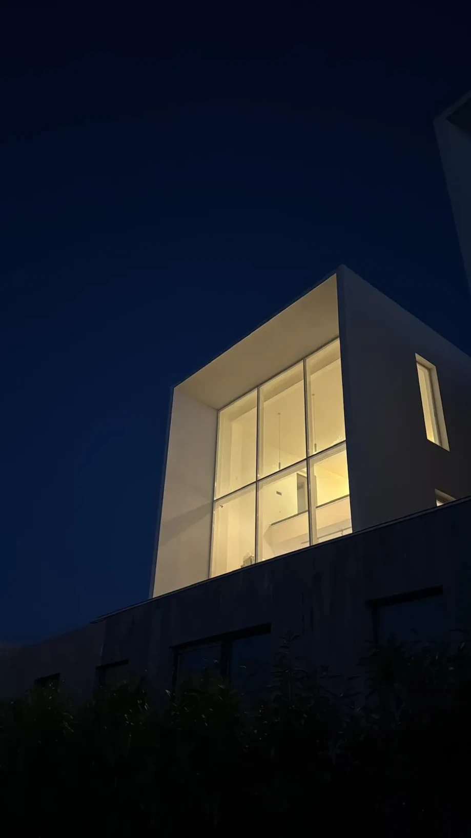 Luxury Villa at Night with Interior Lights On