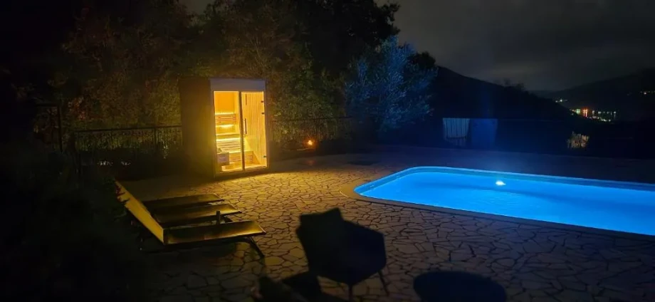 Night Pool with Lit Terrace and Sauna Warm Glow