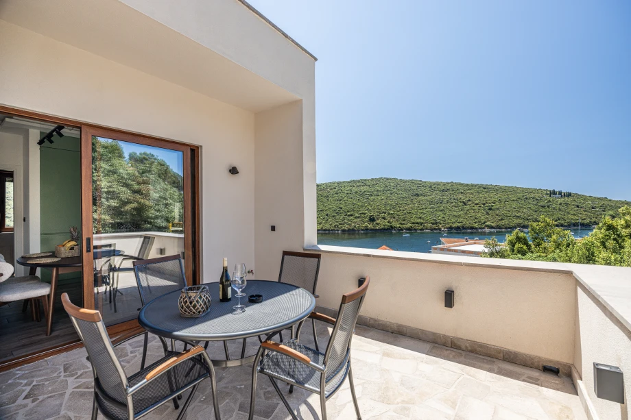 Spacious Sea‑View Balcony with Relaxing Loungers