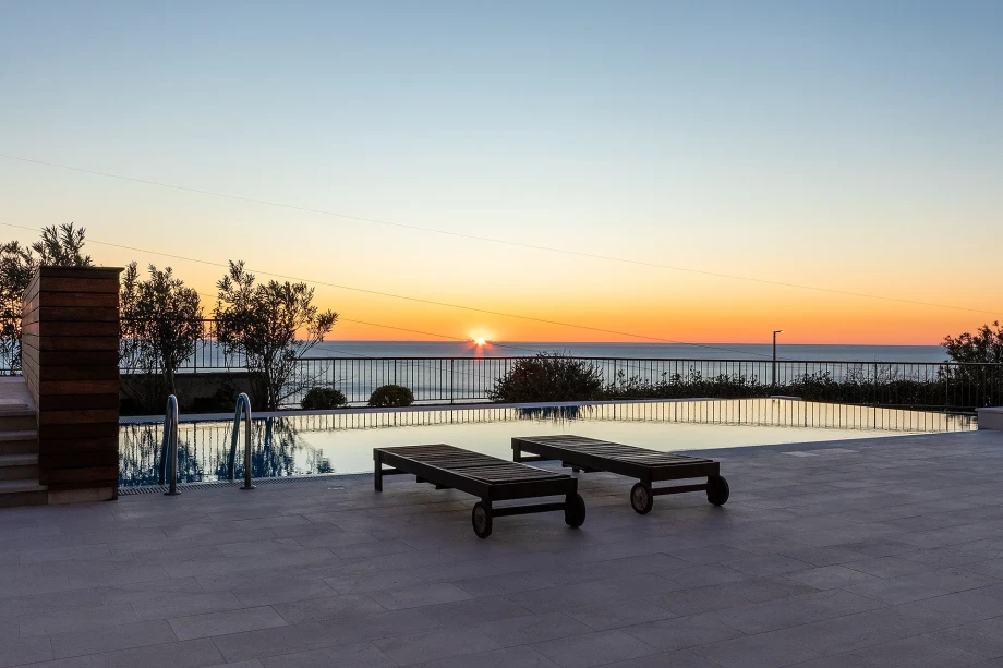 Pool reflecting golden sunset