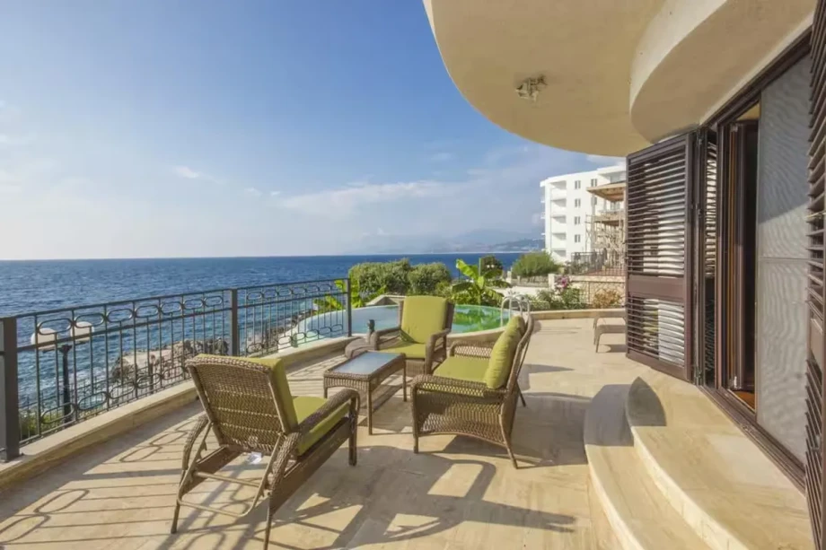Panoramic Terrace Overlooking Infinity Pool and Open Sea Horizon