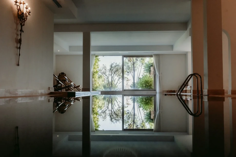 Indoor pool with terrace access at Villa Cliffside Royal Estate