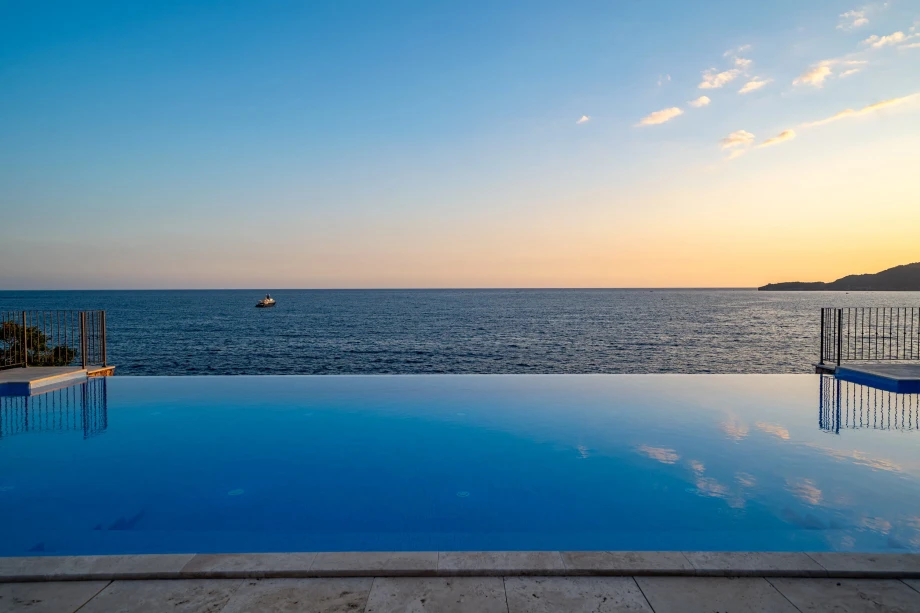 Poolside panorama with sea backdrop at Villa Cliffside Royal Estate
