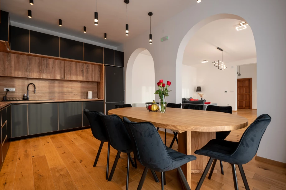 Dining Table with Kitchen Area at Villa Calista Cove Open Interior Layout