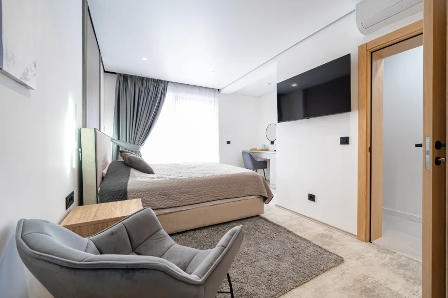 Stylish Bedroom Suite with TV and Lounge Corner | Villa Calma Montenegro