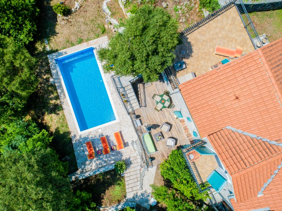 Aerial View of Mediterranean Stone Villa Surrounded by Nature