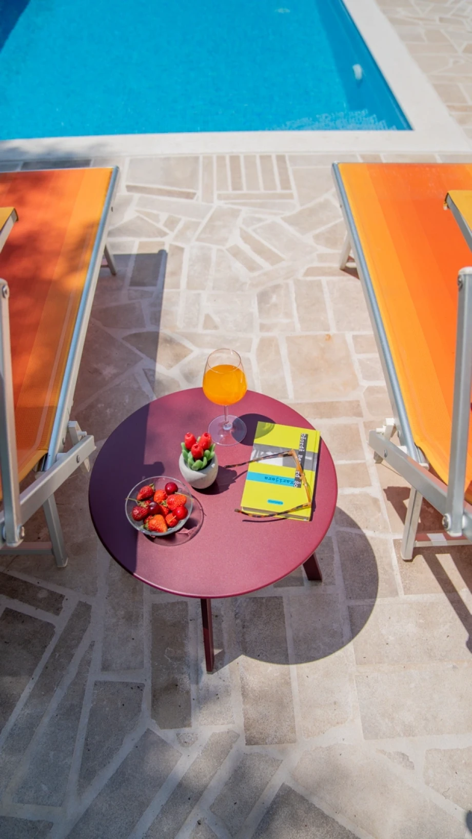Poolside table in a private luxury villa outdoor area