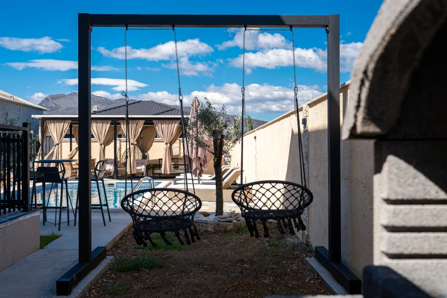 Swing Seating with Bay View at Villa Armonia in a Scenic Outdoor Setting
