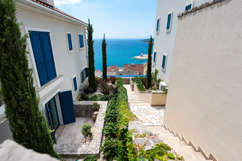 Outdoor Stone Staircase Connecting Terraces at Coastal Elegance Residences