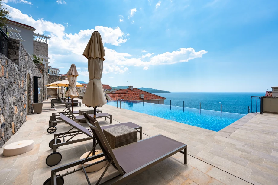 Poolside Sunbathing Deck at Coastal Elegance Residences