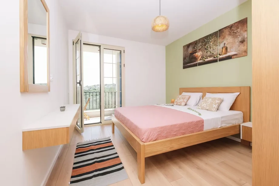 Double Bed in a Stylish Bedroom at Villa Rametto