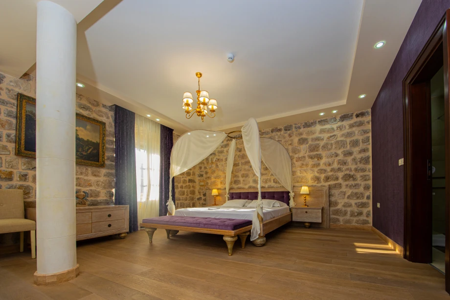 Elegant King Bedroom with Stone Details | Stone House Seafront Villa