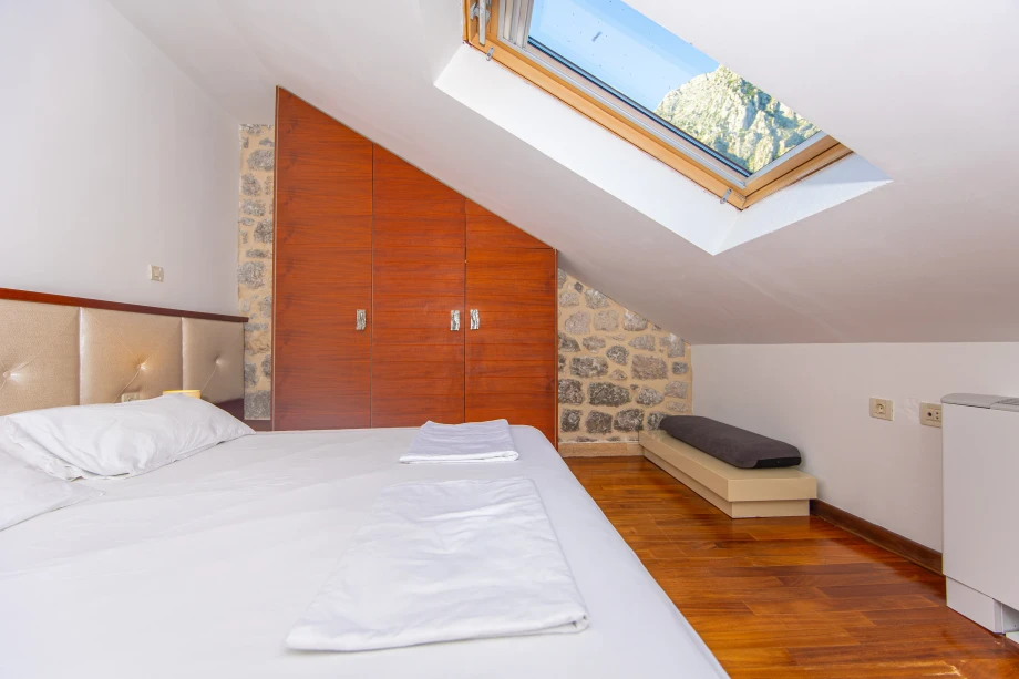 Elegant Bedroom with Skylight | Stone House Seafront Villa