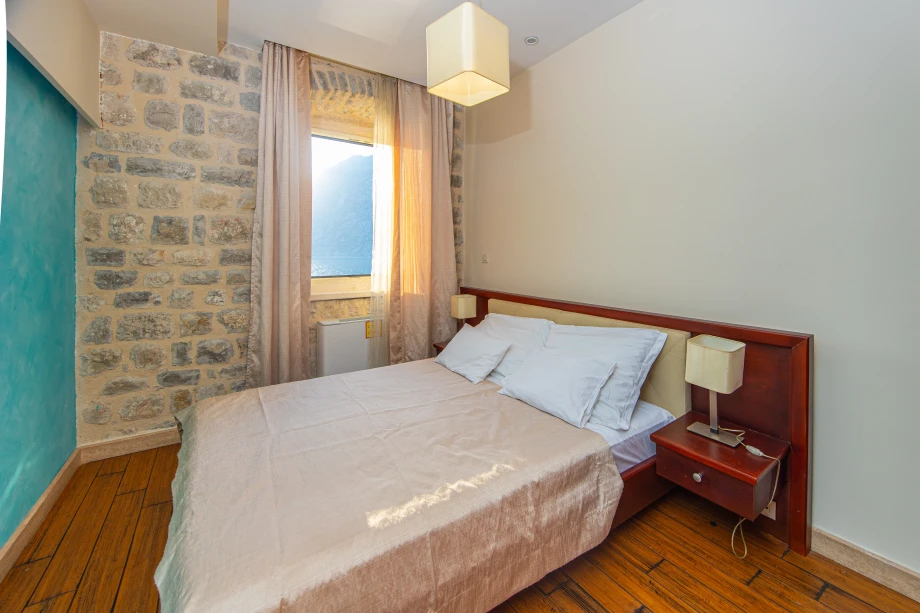 Bed Beside the Window | Stone House Seafront Villa