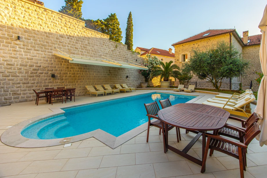 Poolside Sun Loungers Ready for Relaxation | Stone House Seafront Villa
